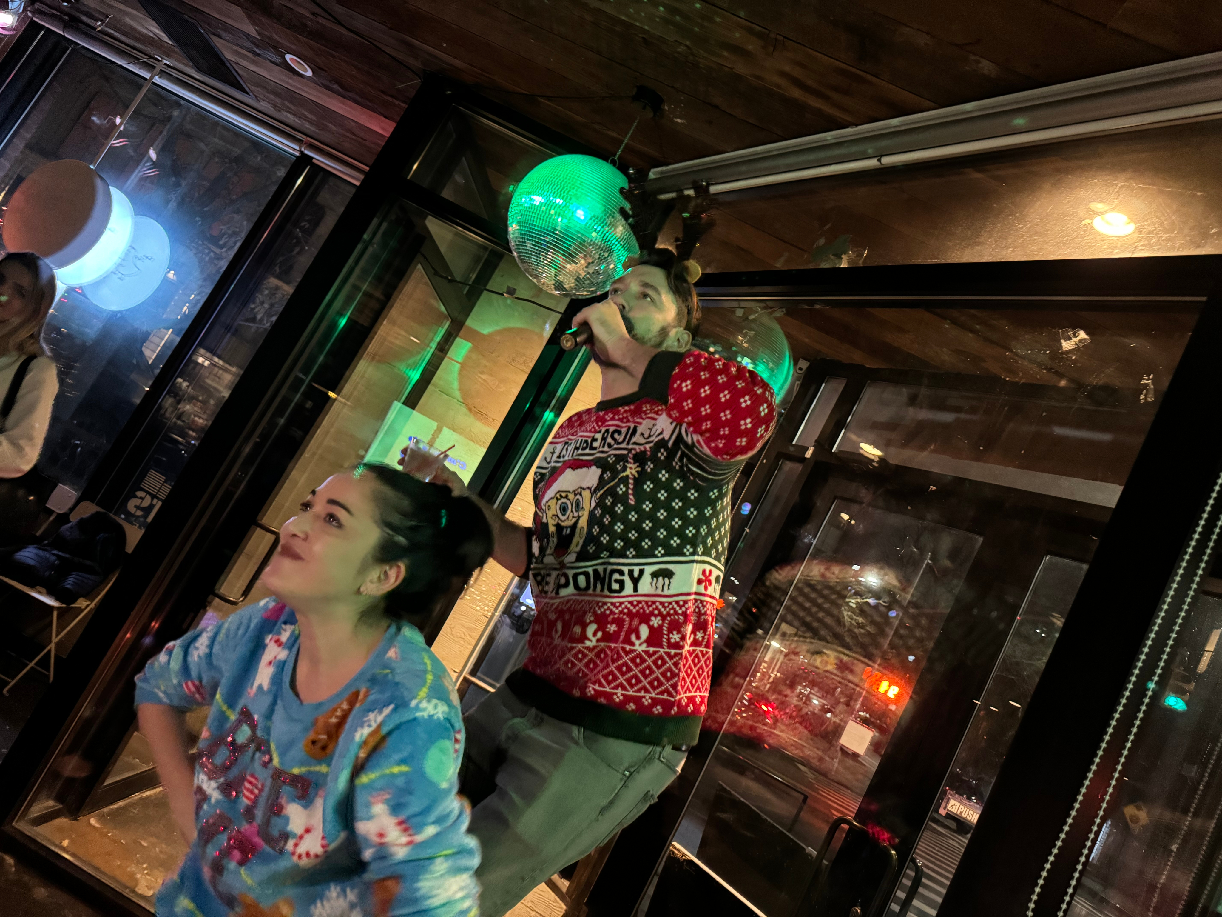 Woman gazing through two glasses of water