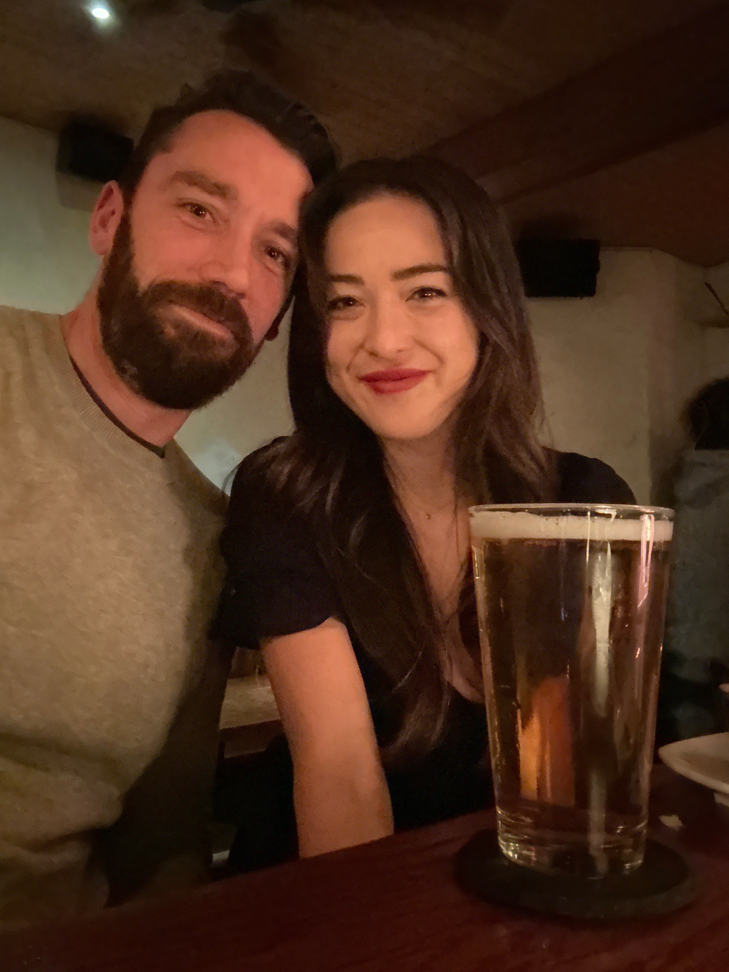 Woman gazing through two glasses of water